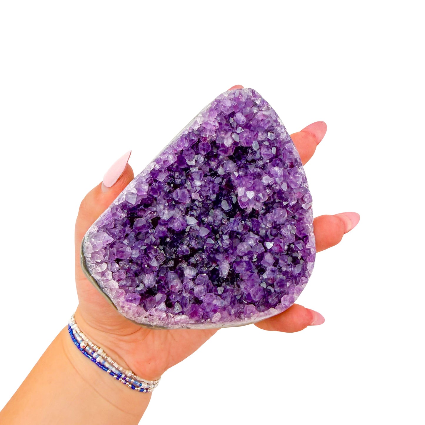 The cut base of amethyst geode no. 125, 3.68 inches of violet druzy standing on a flat cut base.