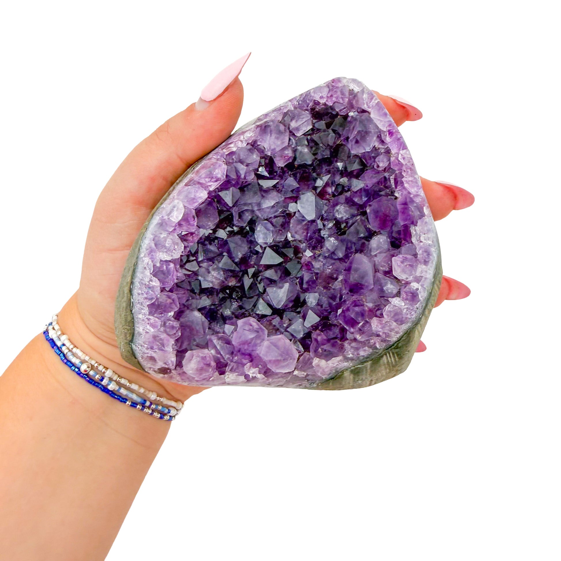 Uruguayan amethyst geode no. 128 at the cut base, violet crystal interior framed by its polished agate shell, 1.66 lb.