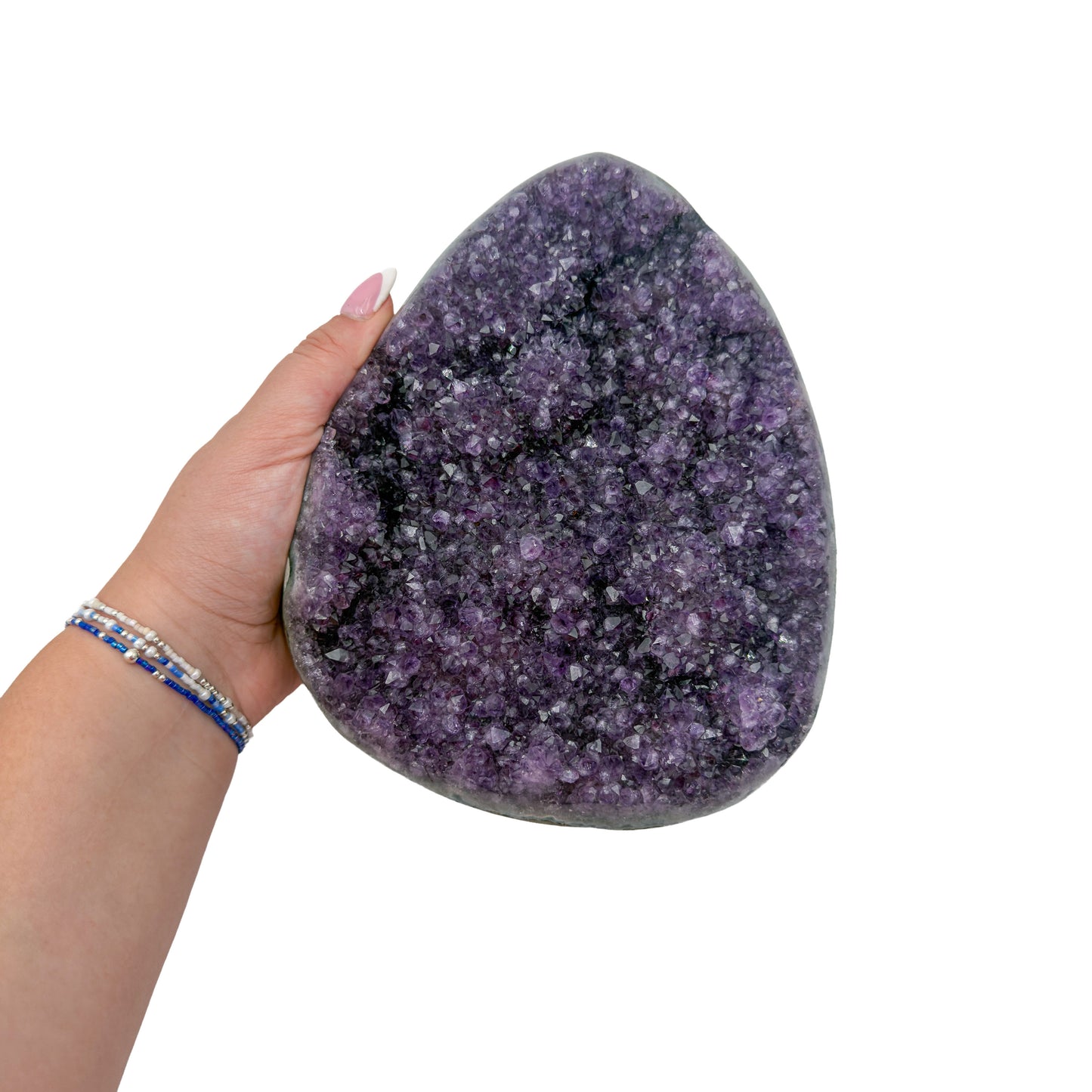 Amethyst polished geode from Uruguay held in an open hand, showing true scale, 4.95 pound broad shield-shaped plate, specimen 10.