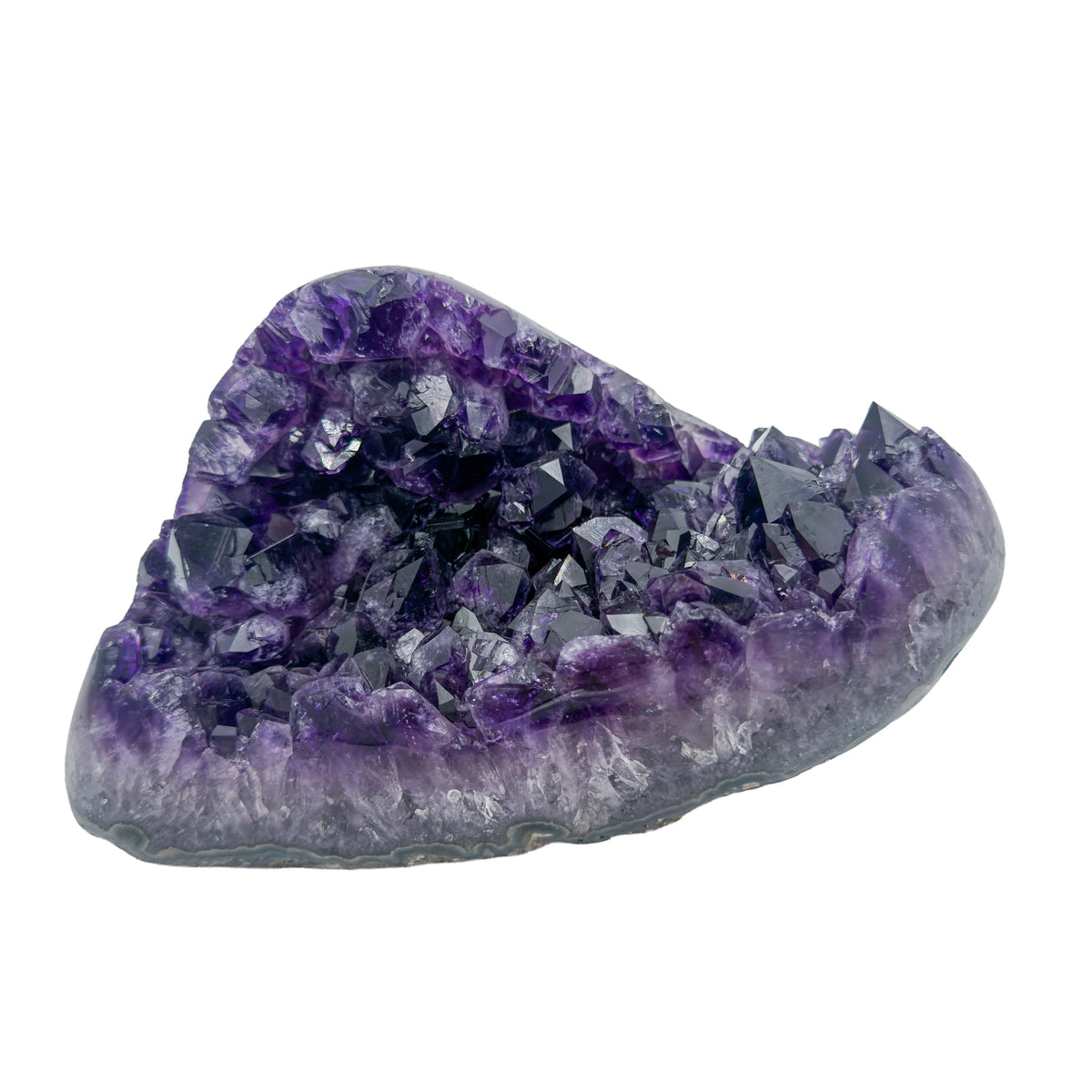 AAA grade amethyst polished geode from Artigas, Uruguay, chunky wedge, large deep purple crystal points, 7.53 x 4.87 x 4.01 in, 4.55 pounds.