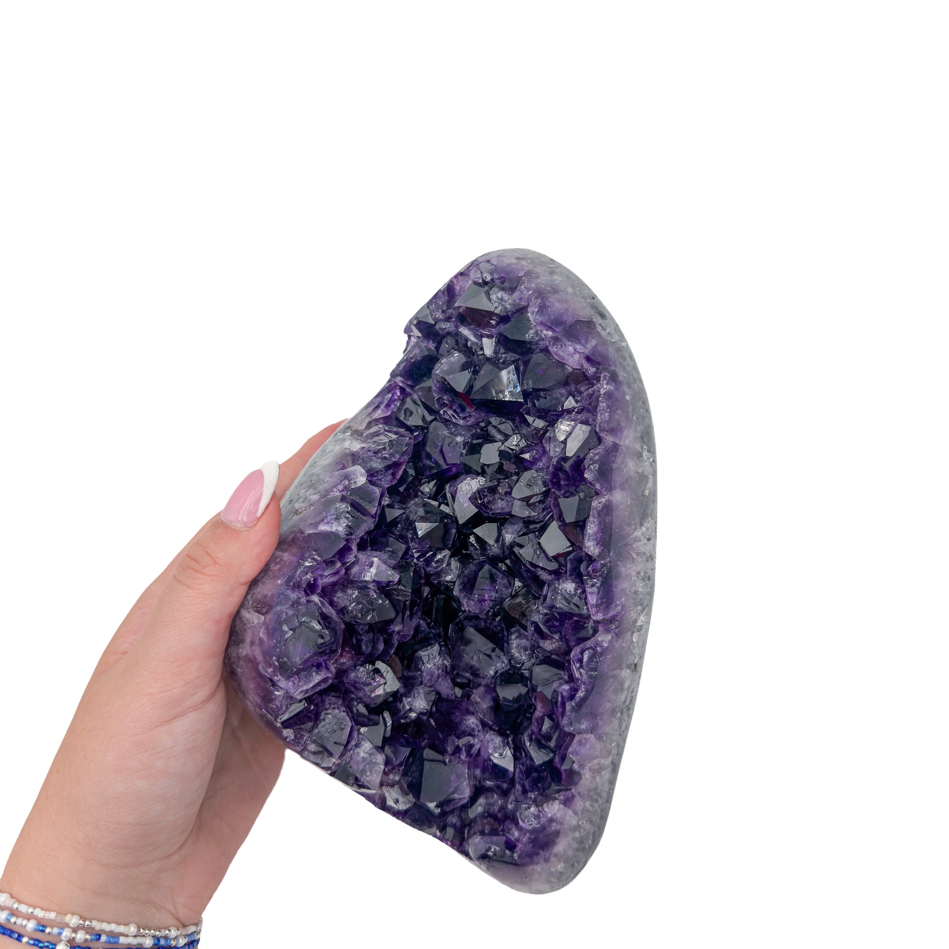 Amethyst polished geode from Uruguay held in an open hand, showing true scale, 4.55 pound chunky wedge, specimen 15.