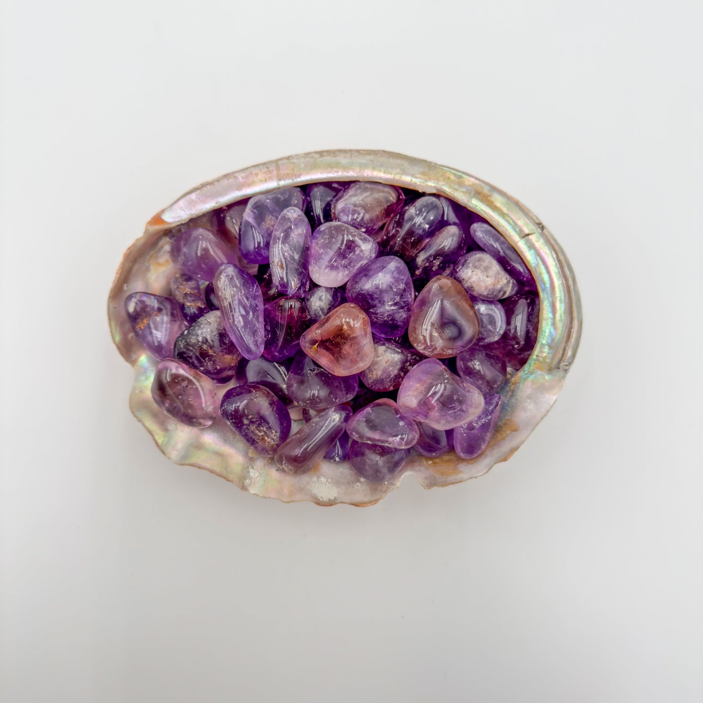 Color detail of Ametrine tumbled stone, often worked with for Focus and Manifestation.