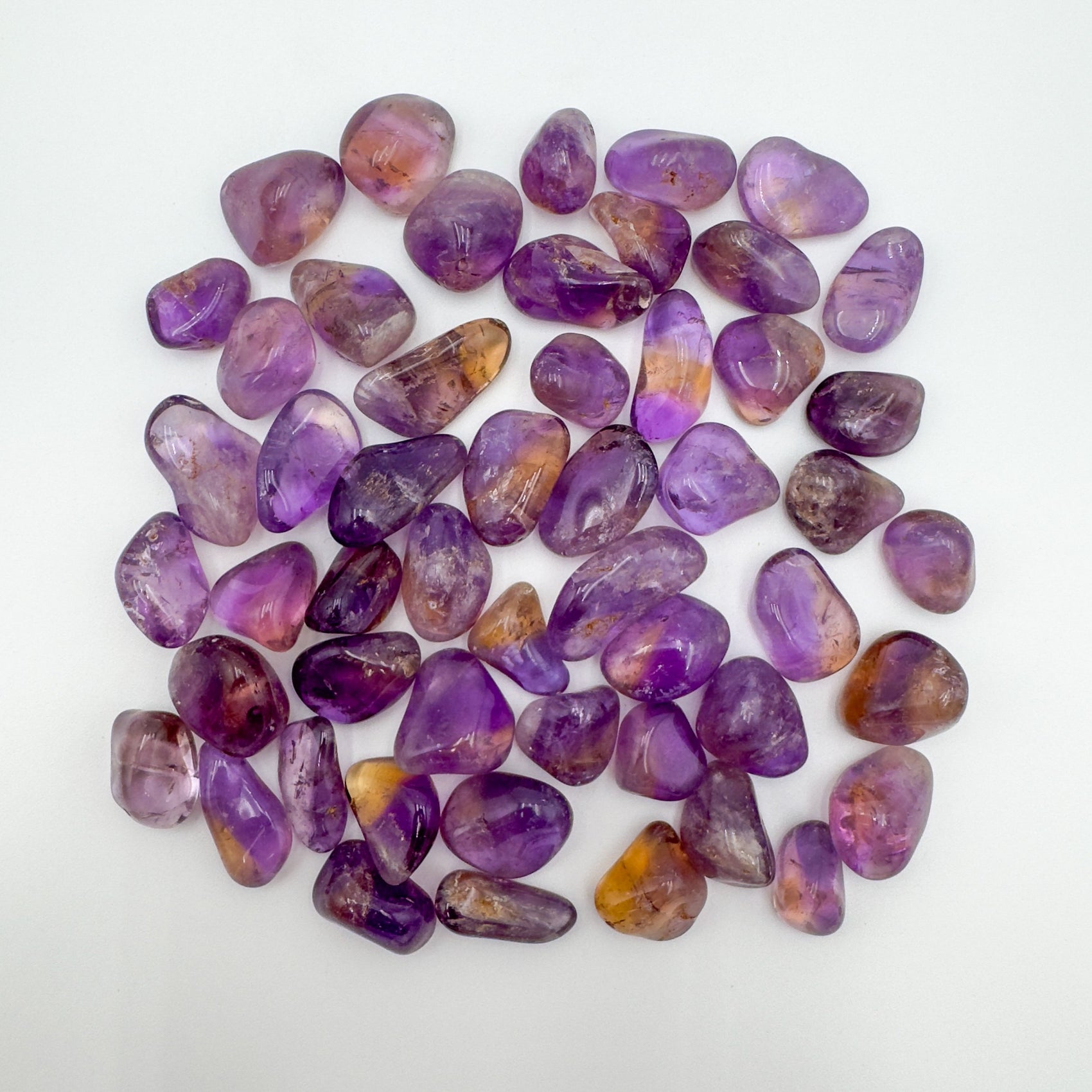 Ametrine tumbled stone in Purple, Yellow tones, ethically sourced from Bolivia for Abundance and Confidence