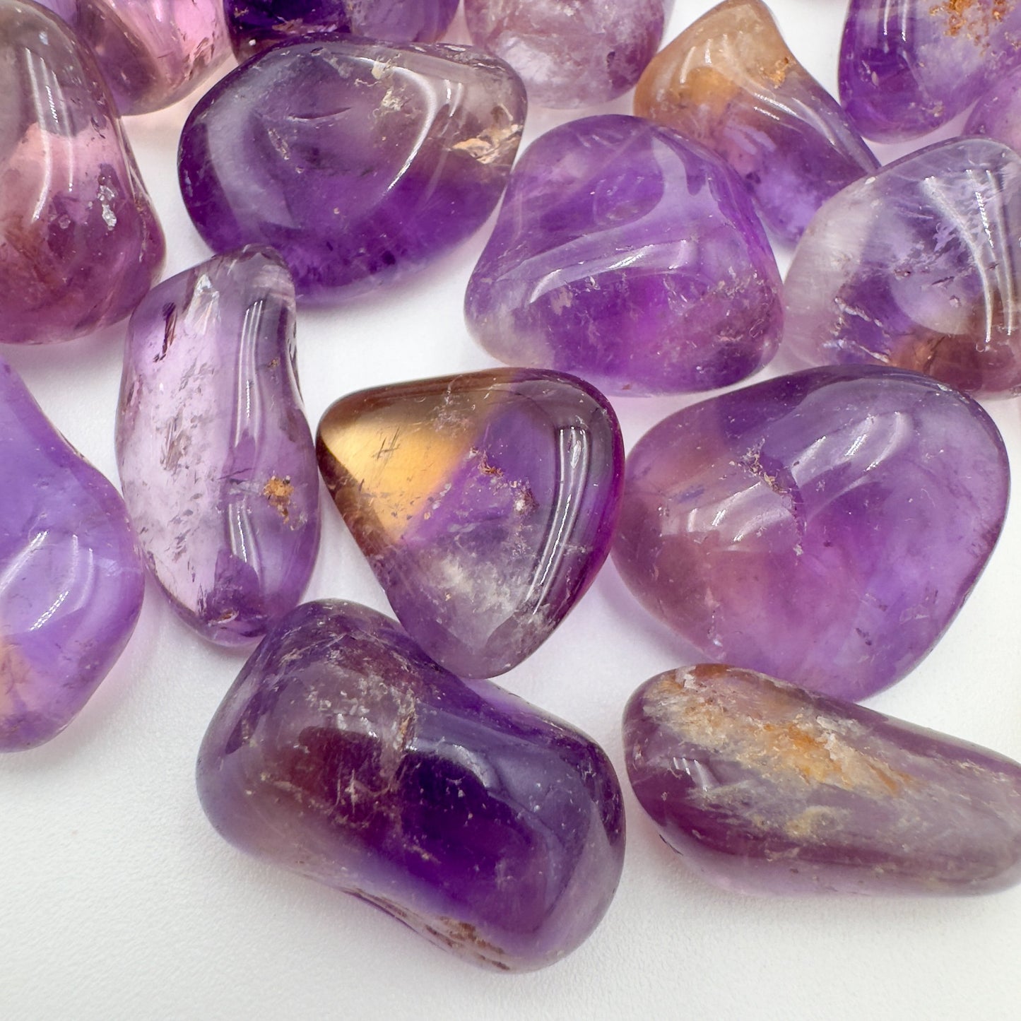 Side profile of Ametrine tumbled stone, sourced from Ángel Sandoval Province, Bolivia.