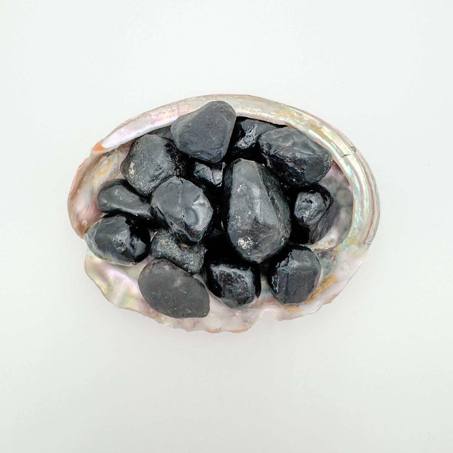 Grain detail of Apache Tear raw stone, showing natural form.