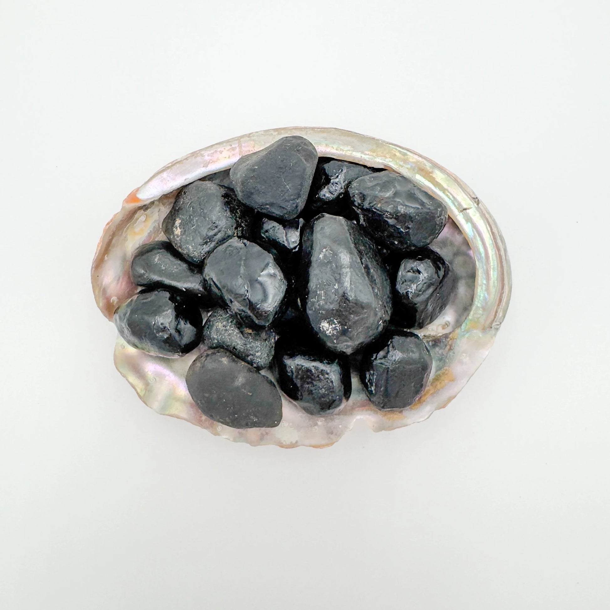 Grain detail of Apache Tear raw stone, showing natural form.