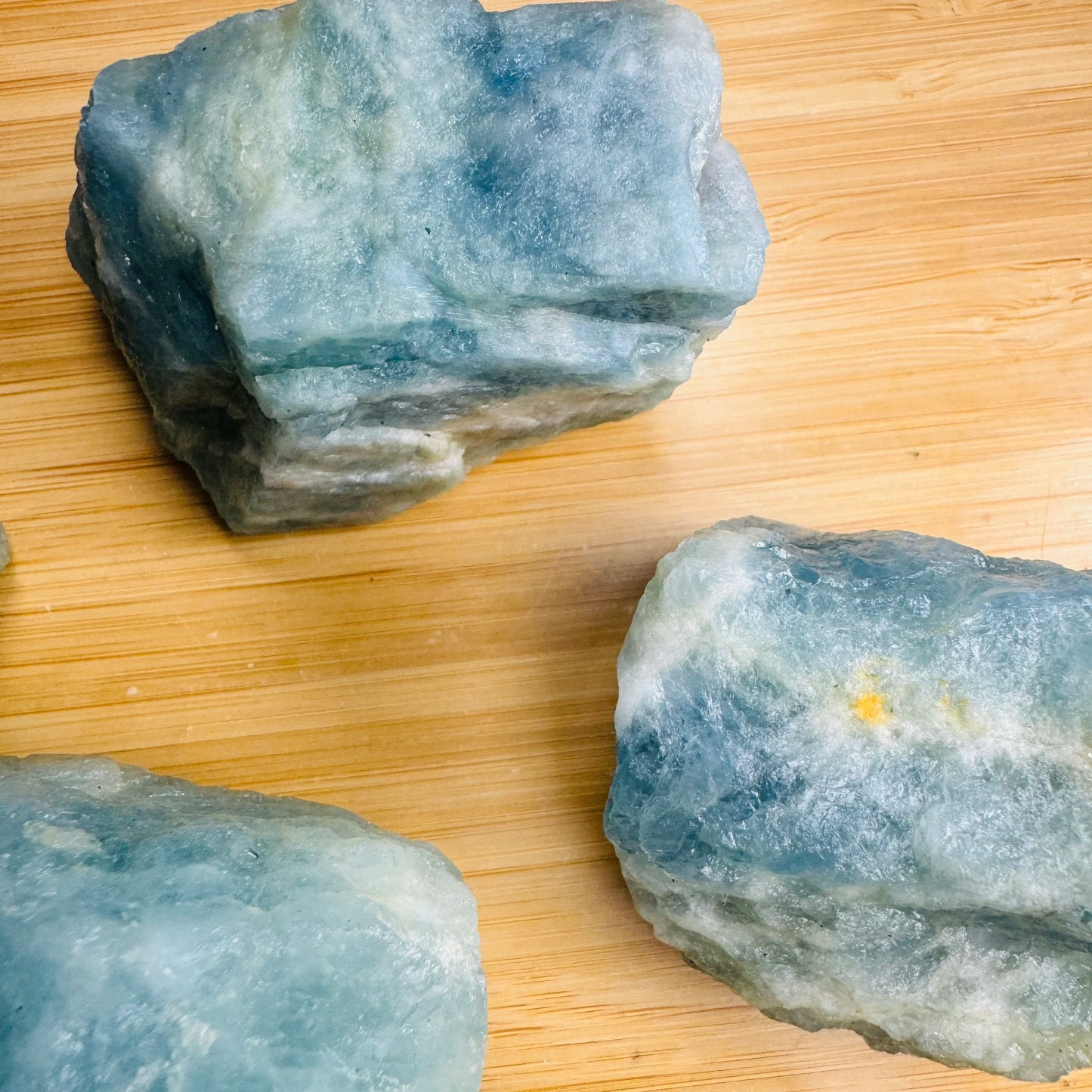 Lateral view of Aquamarine raw stone, showing untreated character.