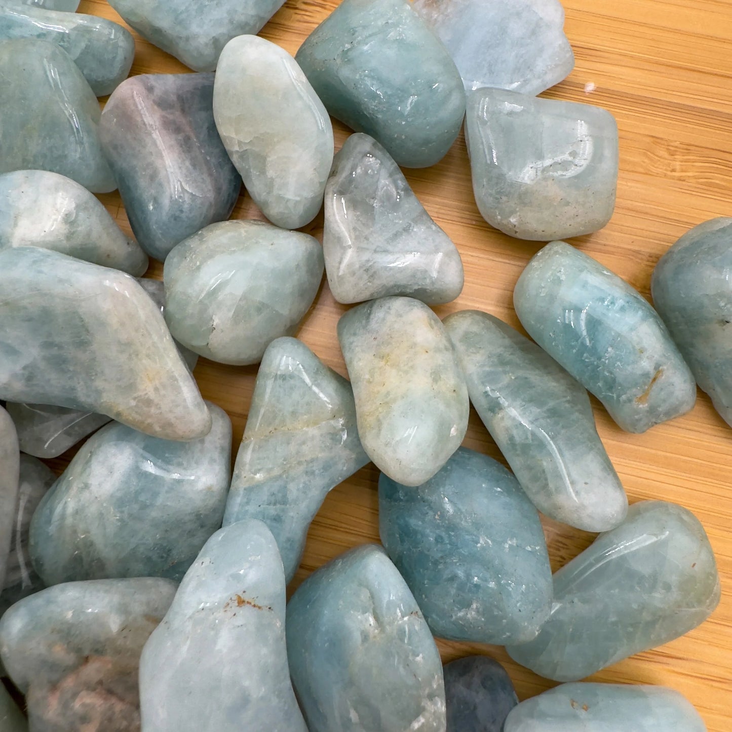 Rear view of Aquamarine tumbled stone, sourced from Minas Gerais, Brazil.