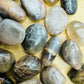 Color detail of Black Moonstone tumbled stone, from Madagascar, to support Grounding.