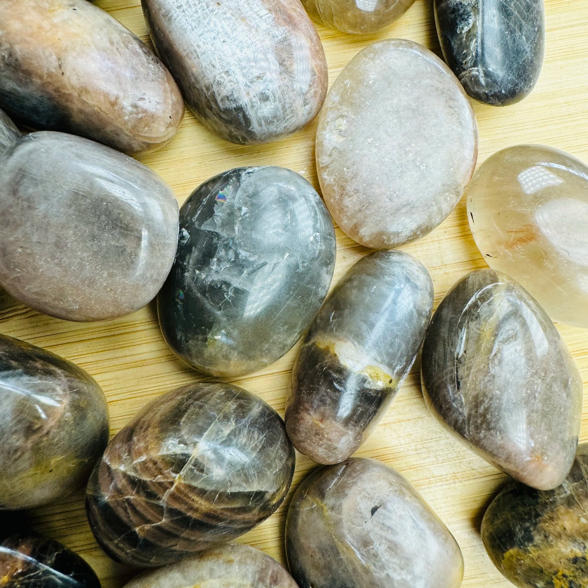 Color detail of Black Moonstone tumbled stone, from Madagascar, to support Grounding.