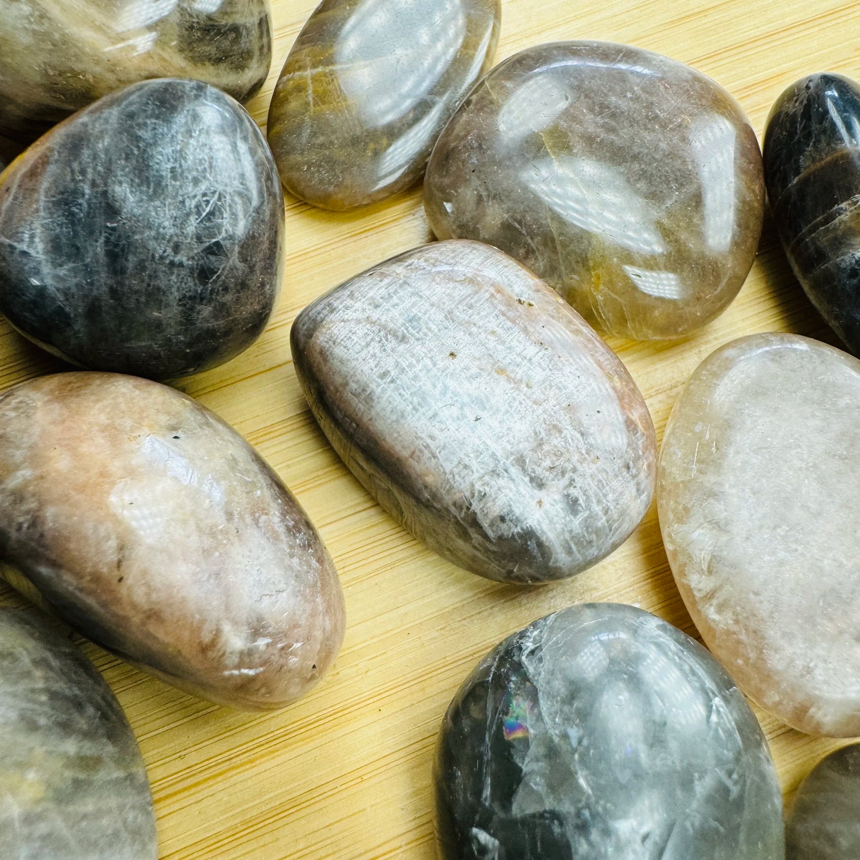 Edge-on view of Black Moonstone tumbled stone, Madagascar-sourced.