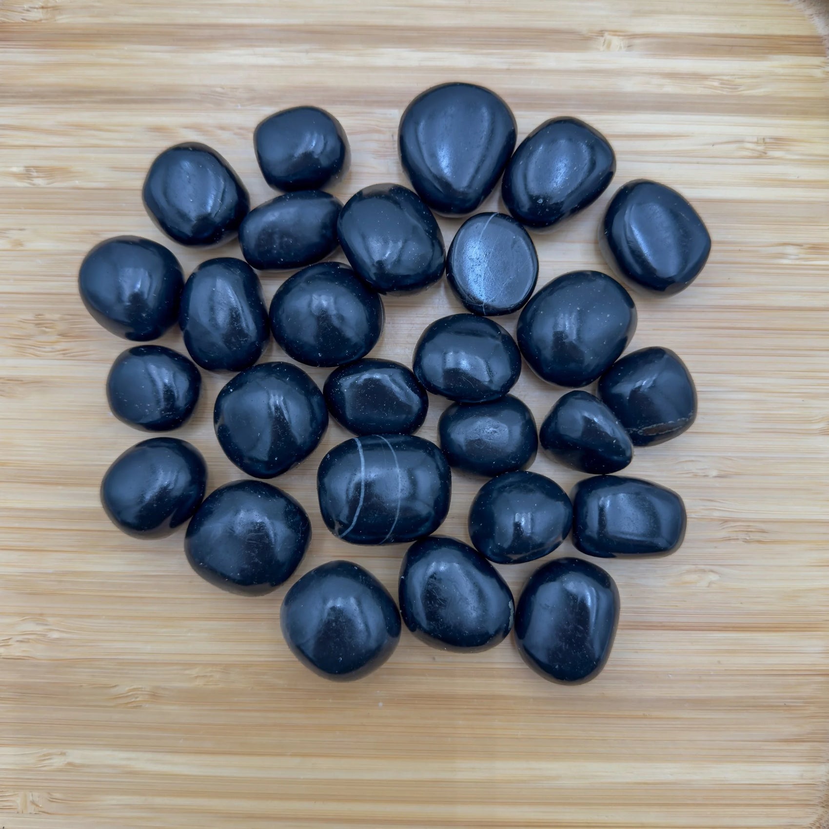 Full profile of Grade AA Black Onyx tumbled stone ready to ship from Beyond Bohemian
