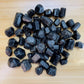 Profile view of Black Tourmaline raw stone, Zimbabwe-sourced, carried for Protection.