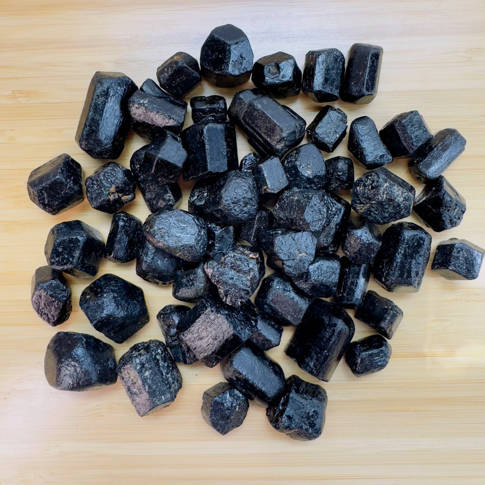 Black Tourmaline raw crystal in Black tones, ethically sourced from Zimbabwe for Stress Relief and Cleansing