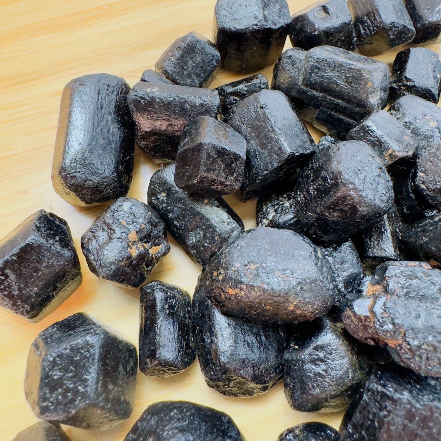 Daylight view of a single Black Tourmaline raw stone from Zimbabwe.