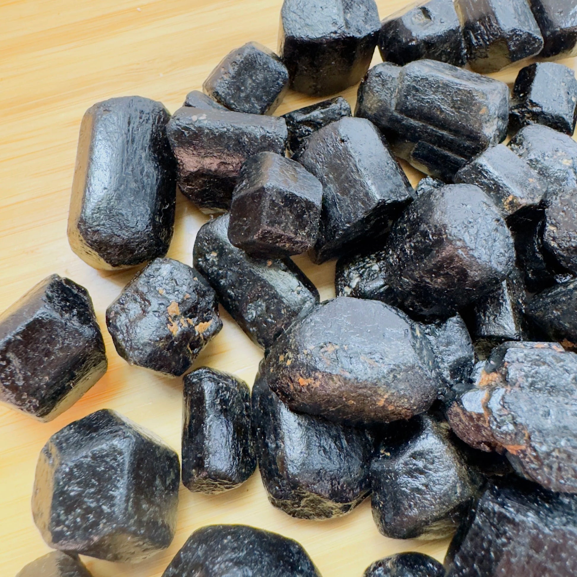 Daylight view of a single Black Tourmaline raw stone from Zimbabwe.