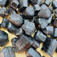 Reverse side of Black Tourmaline raw stone, showing natural patina.
