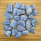 Field-of-view of Blue Lace Agate tumbled stone, with hand-sized presence.