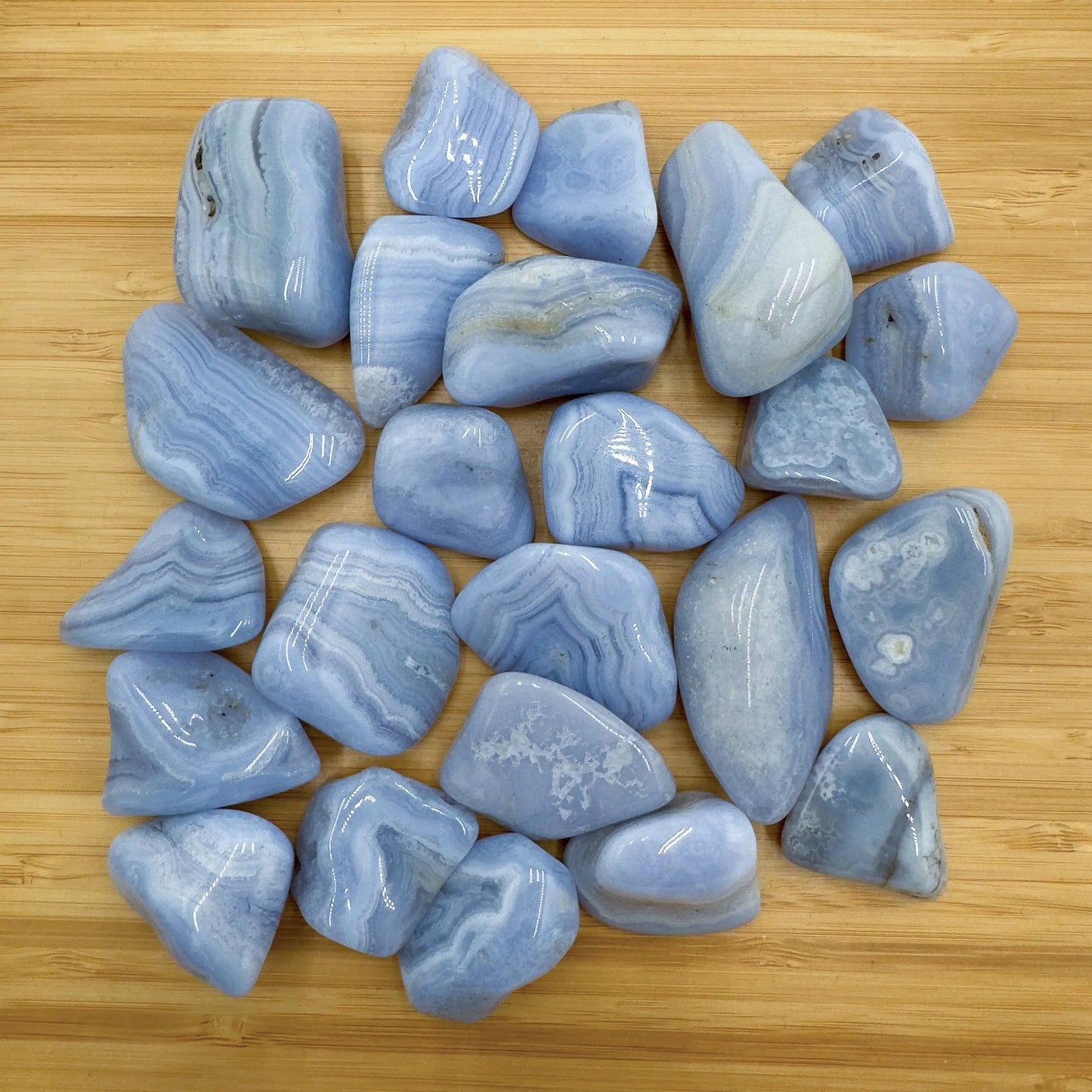 Field-of-view of Blue Lace Agate tumbled stone, with hand-sized presence.