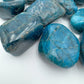 Side profile of Apatite tumbled stone, showing matte finish.
