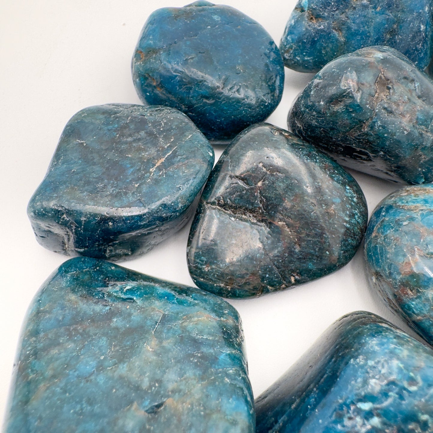 Alternate side of Apatite tumbled stone, showing soft luster, worked with for Focus and Manifestation.