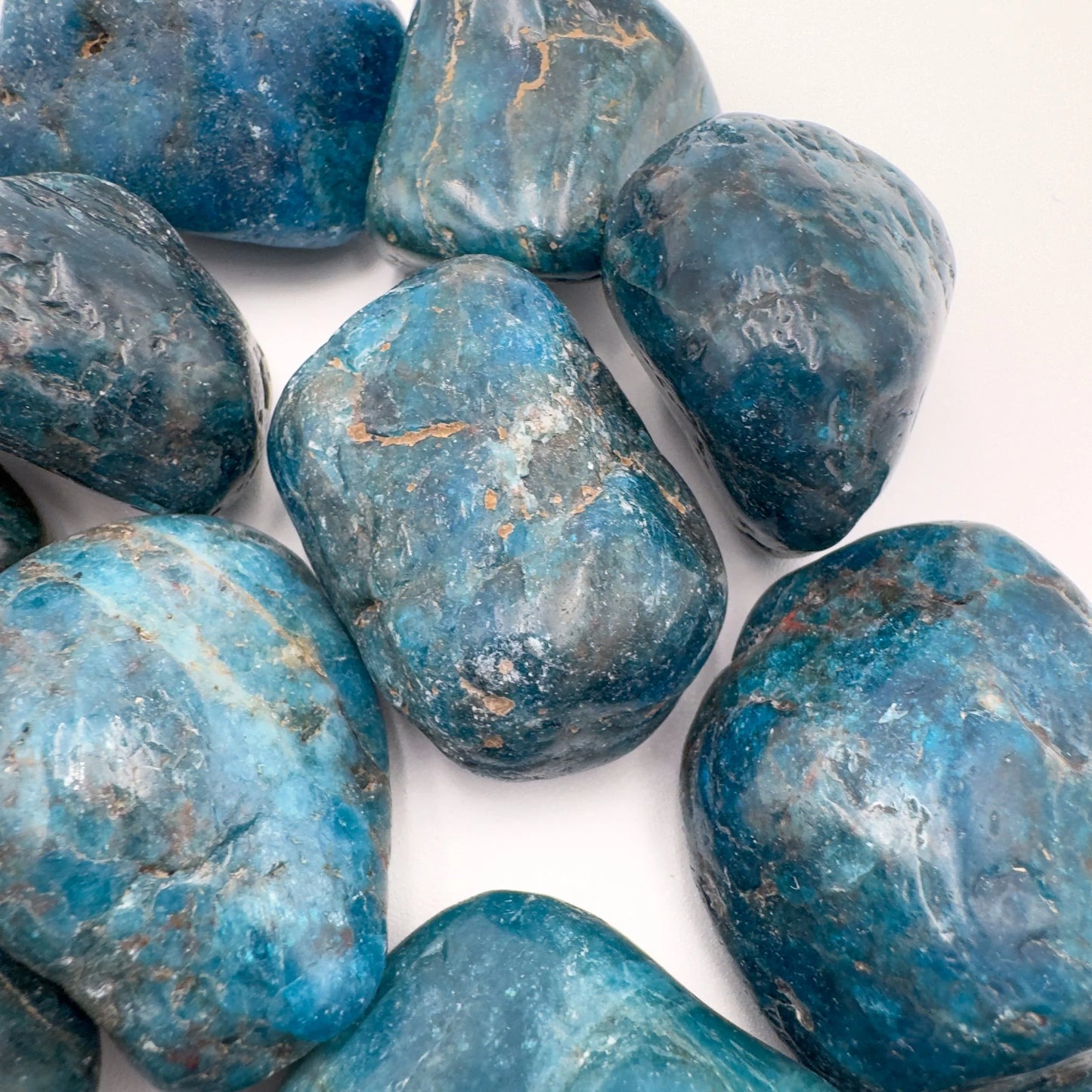 Hand-scale shot of a Apatite tumbled stone, sourced from Madagascar.