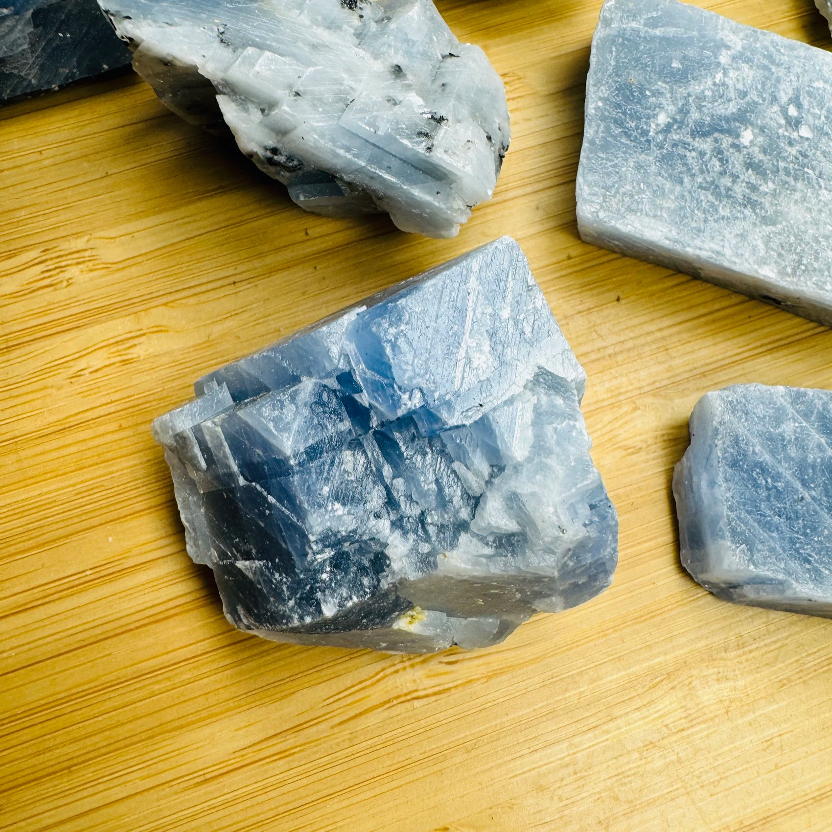 Detail shot showing Grade AA Blue Calcite raw stone, sourced from Erongo, Namibia, turned to for Stress Relief.