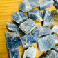 Bird's-eye view of Blue Calcite raw stone, worked with for Stress Relief and Emotional Healing, showing characteristic patterning.