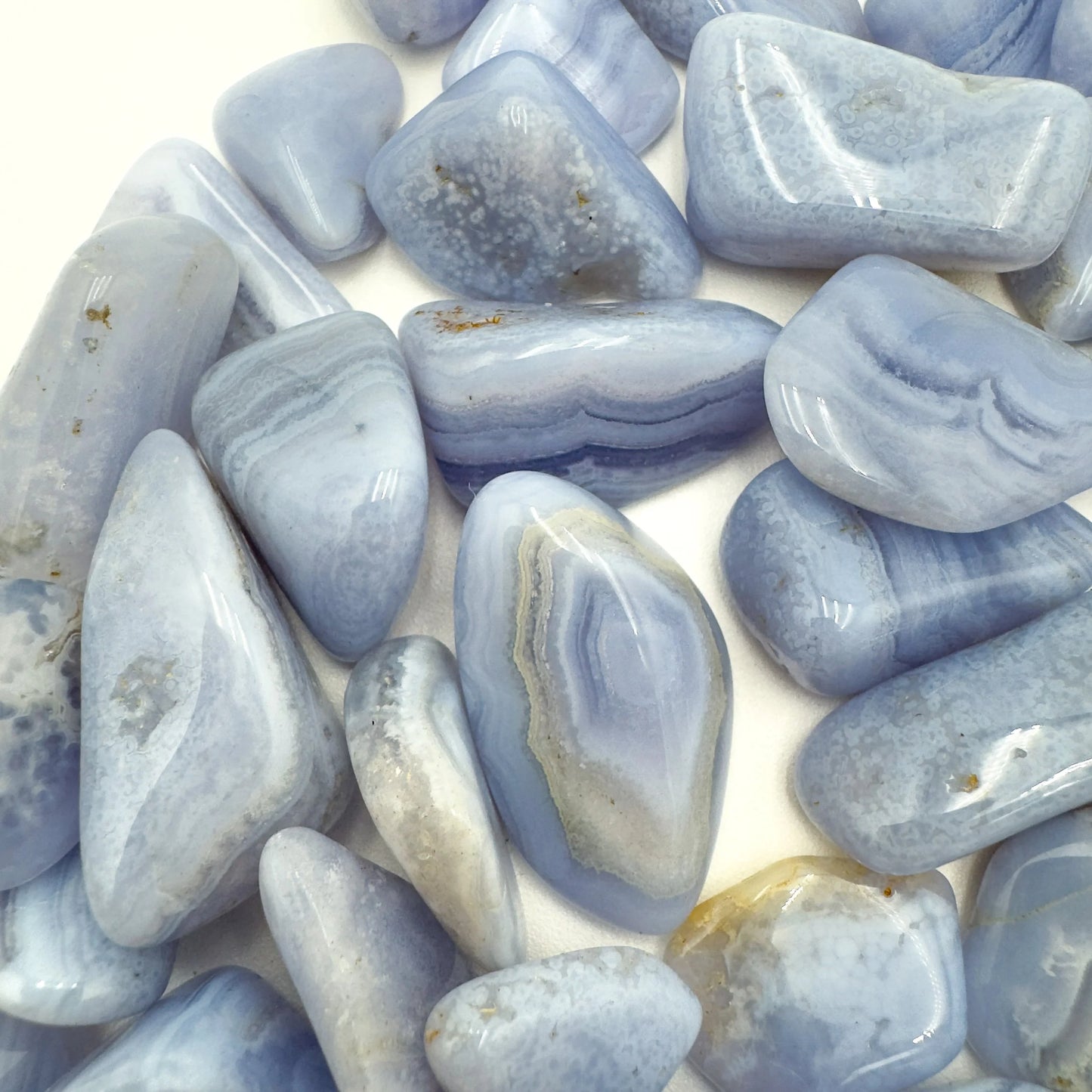 Reverse side of Blue Lace Agate tumbled stone, hand-selected from ǁKaras Region, Namibia, showing natural variation.