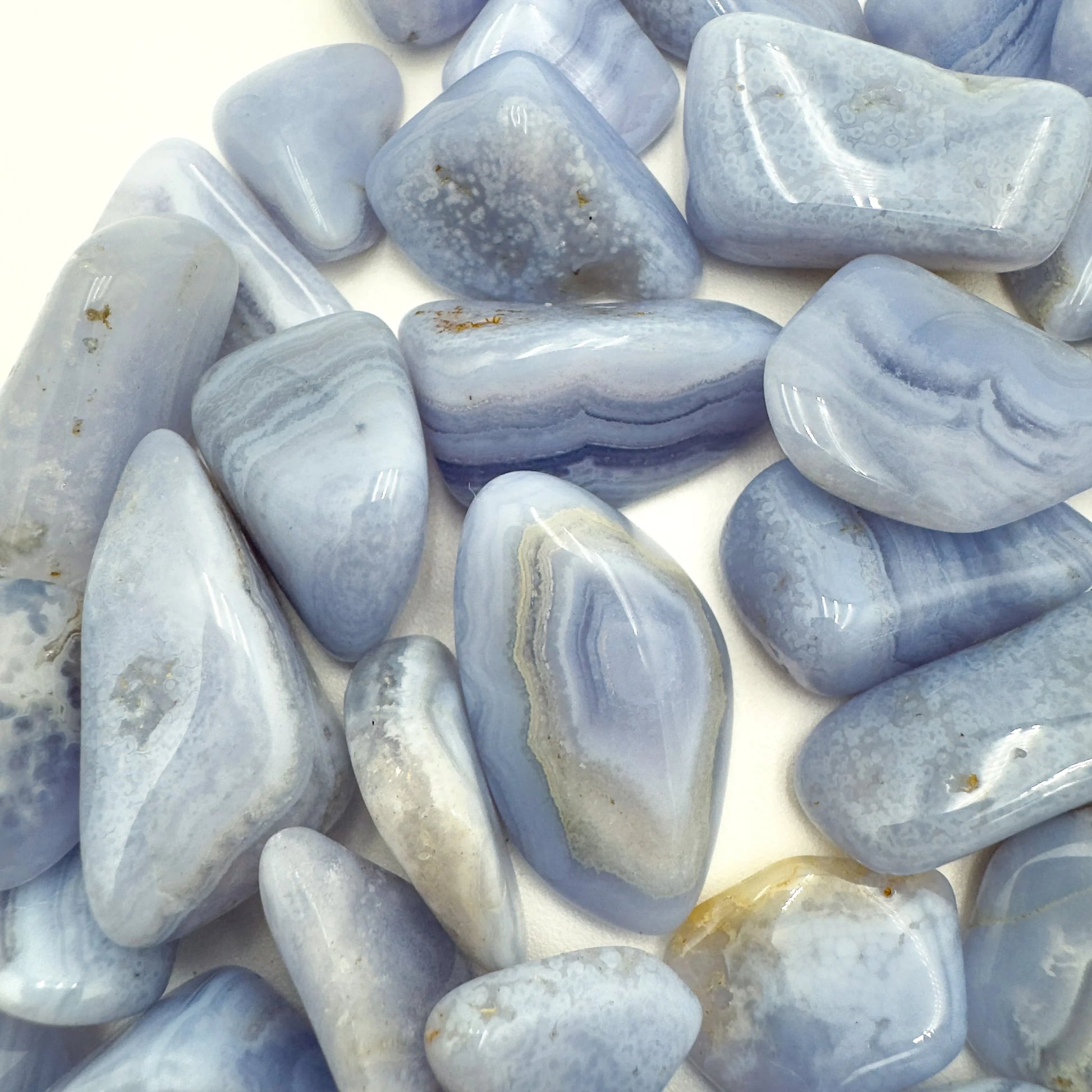 Reverse side of Blue Lace Agate tumbled stone, hand-selected from ǁKaras Region, Namibia, showing natural variation.