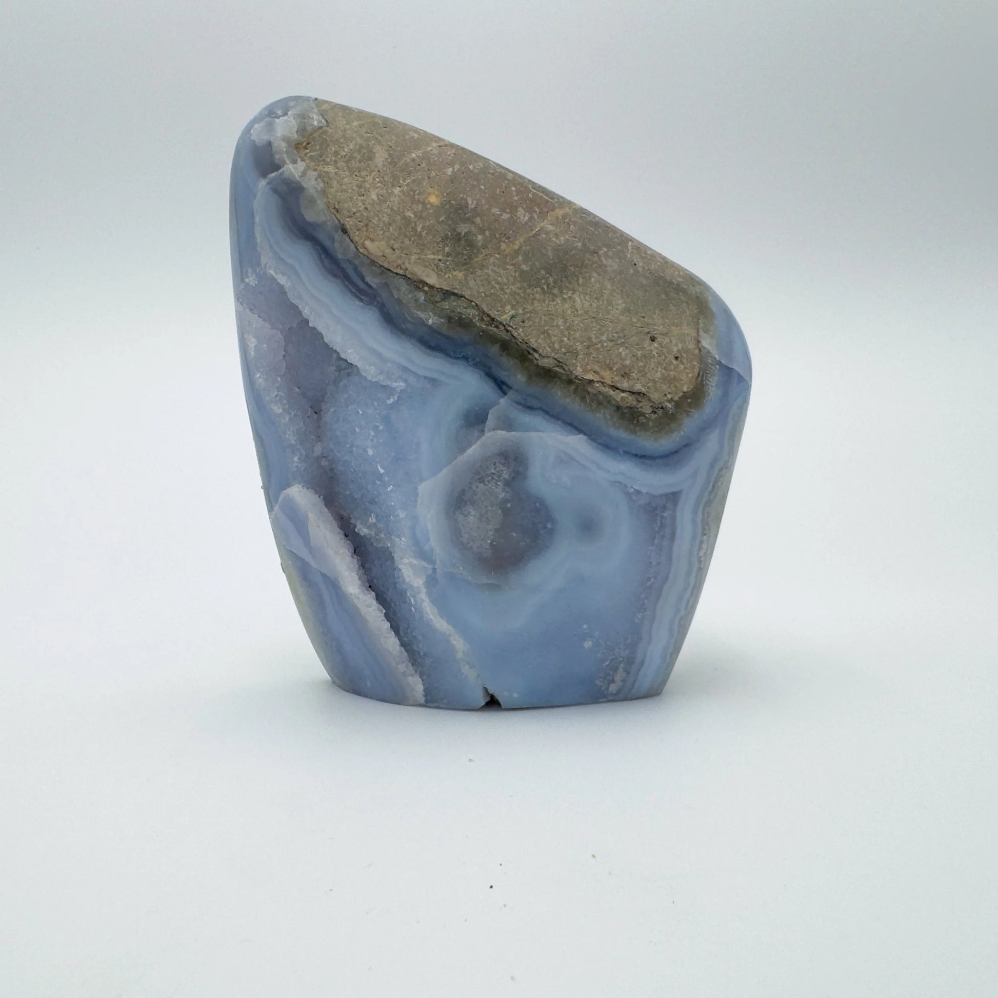 Detail capture of Grade AA Blue Lace Agate raw geode, hand-selected from Nsipe, Malawi, showing characteristic finish.