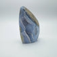 Edge view of Blue Lace Agate raw geode, drawn on for Stress Relief, showing natural banding.