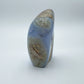 Grade aa blue lace agate geode held in hand for size reference