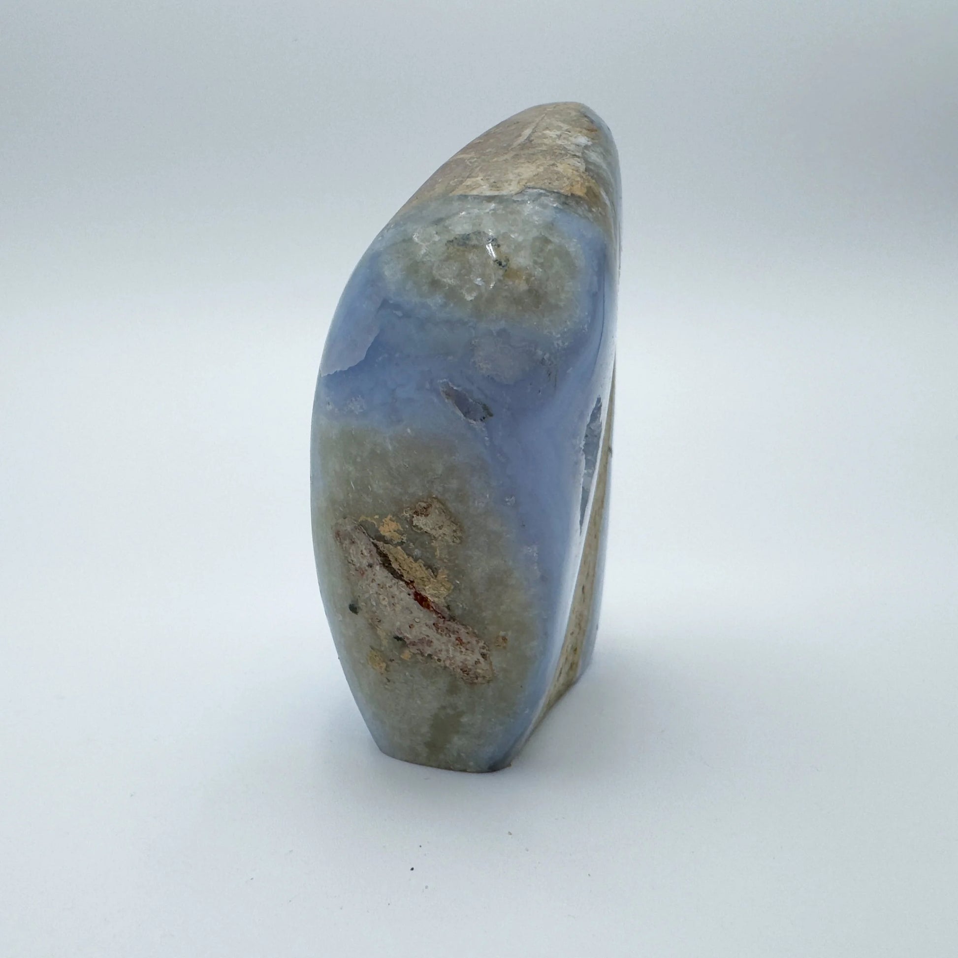 Grade aa blue lace agate geode held in hand for size reference