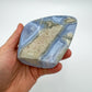 Detail shot of Grade AA Blue Lace Agate geode under natural light