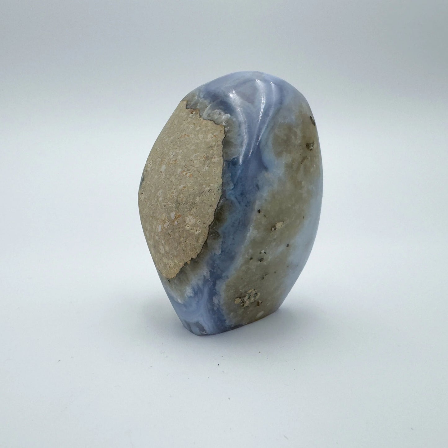 Opposite side of Grade AA Blue Lace Agate raw geode, showing natural banding, drawn on for Stress Relief and Emotional Healing.