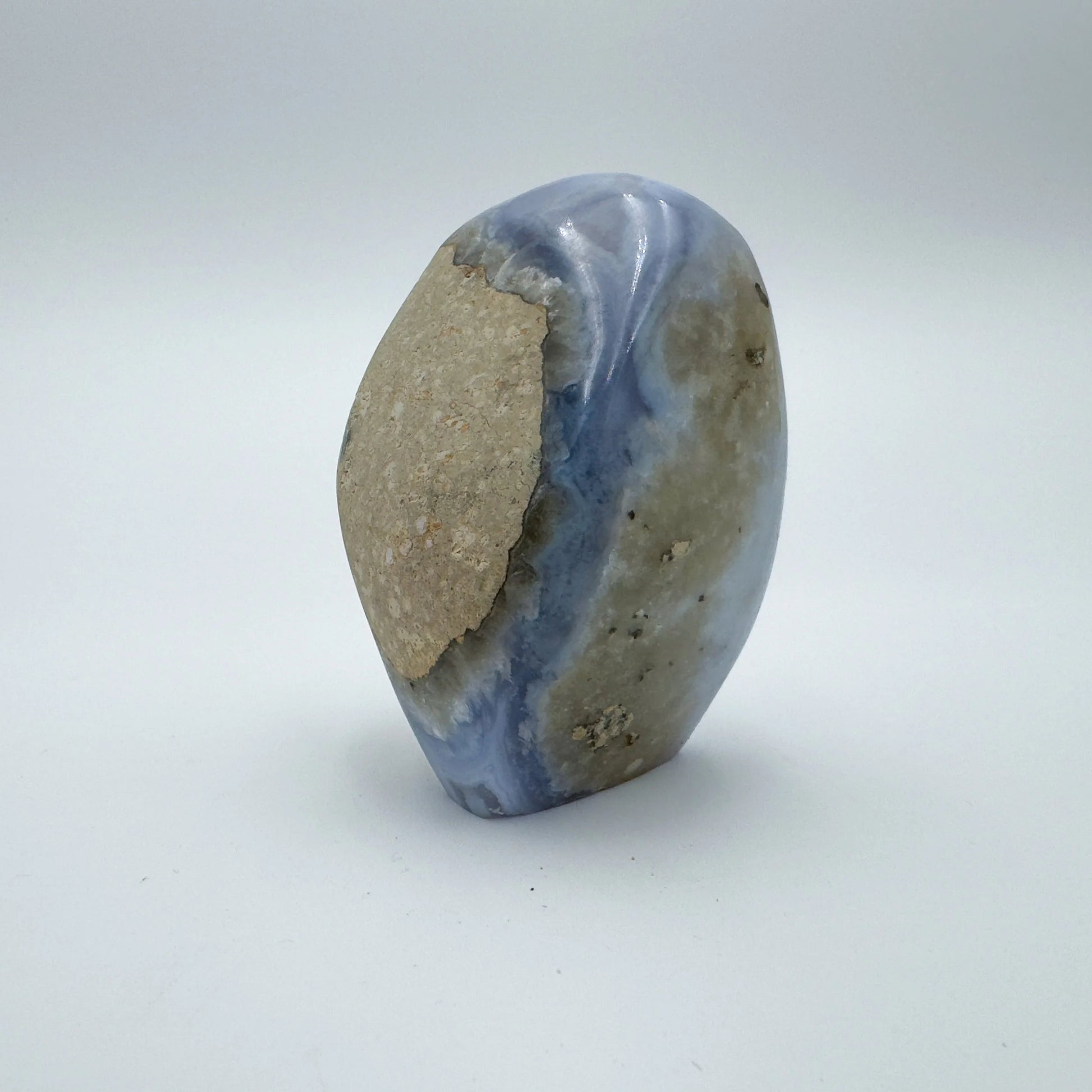 Opposite side of Grade AA Blue Lace Agate raw geode, showing natural banding, drawn on for Stress Relief and Emotional Healing.