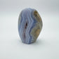Grade aa blue lace agate geode held in hand for size reference