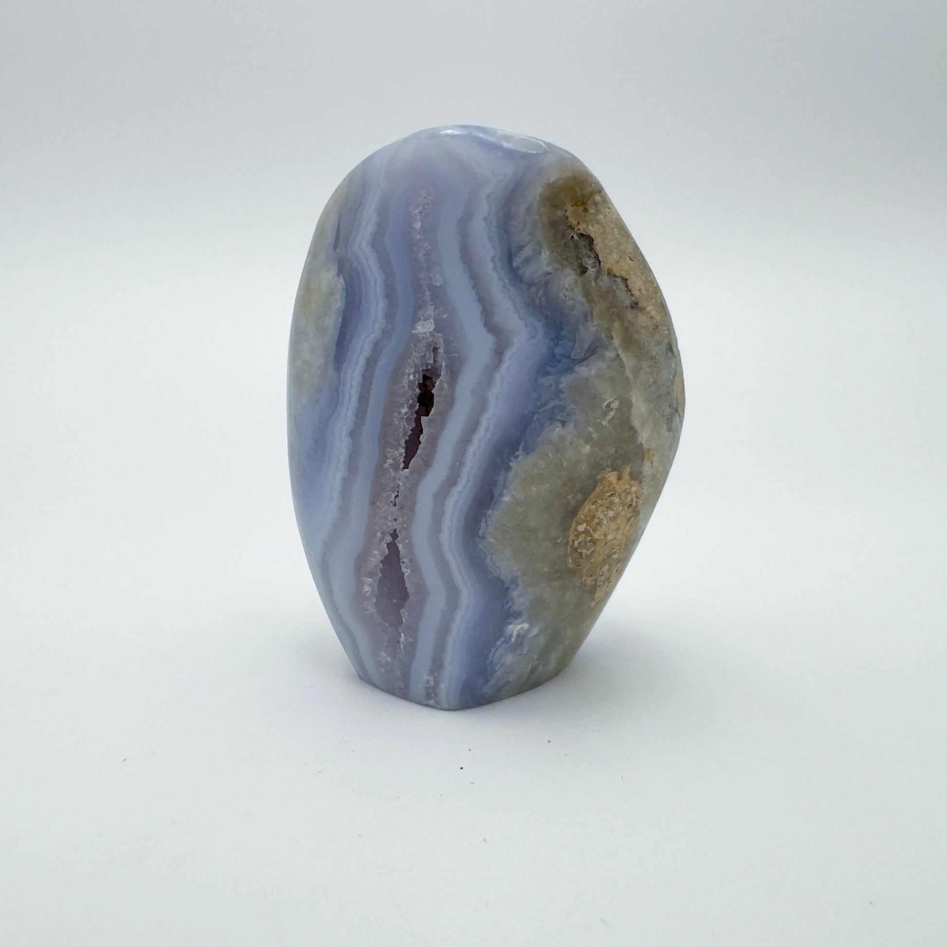 Grade aa blue lace agate geode held in hand for size reference