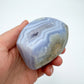 Detail shot of Grade AA Blue Lace Agate geode under natural light