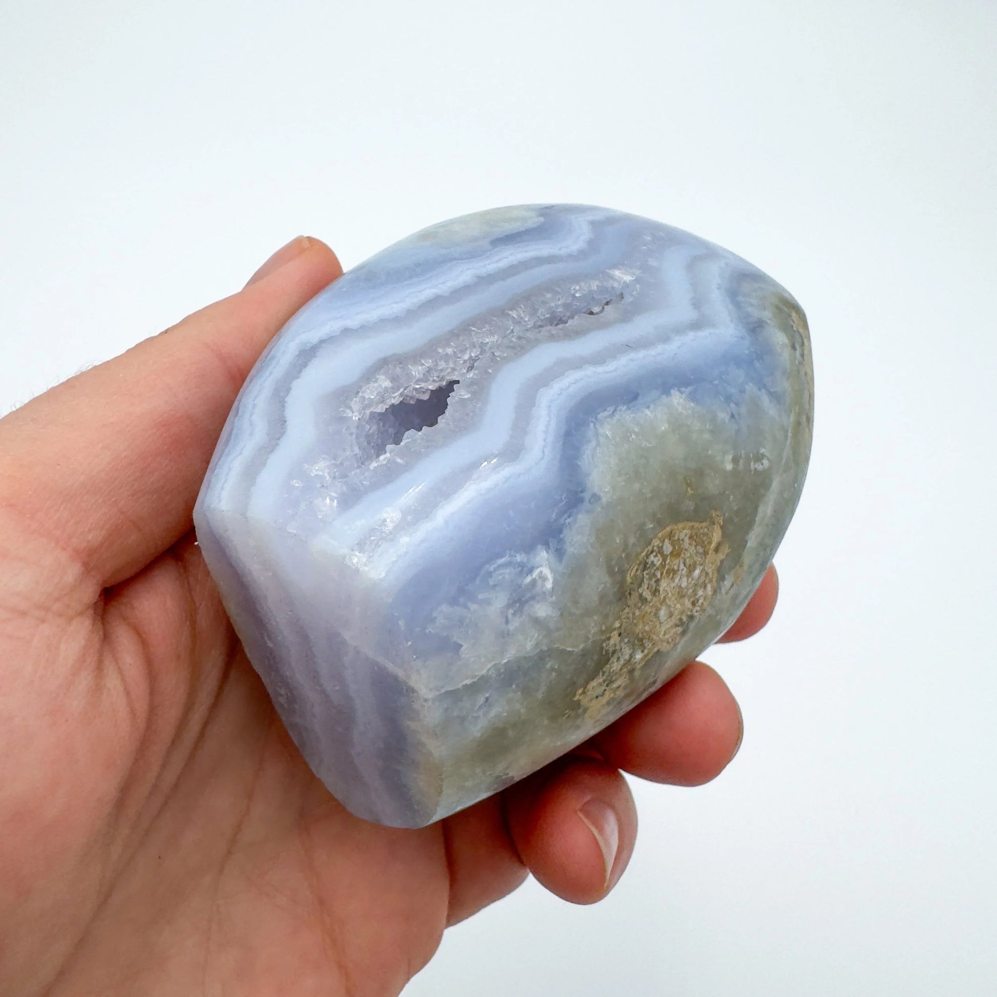 Detail shot of Grade AA Blue Lace Agate geode under natural light