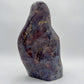 Sideways view of Blue Rose Quartz freeform, kept close for Stress Relief and Emotional Healing, showing natural inclusions.