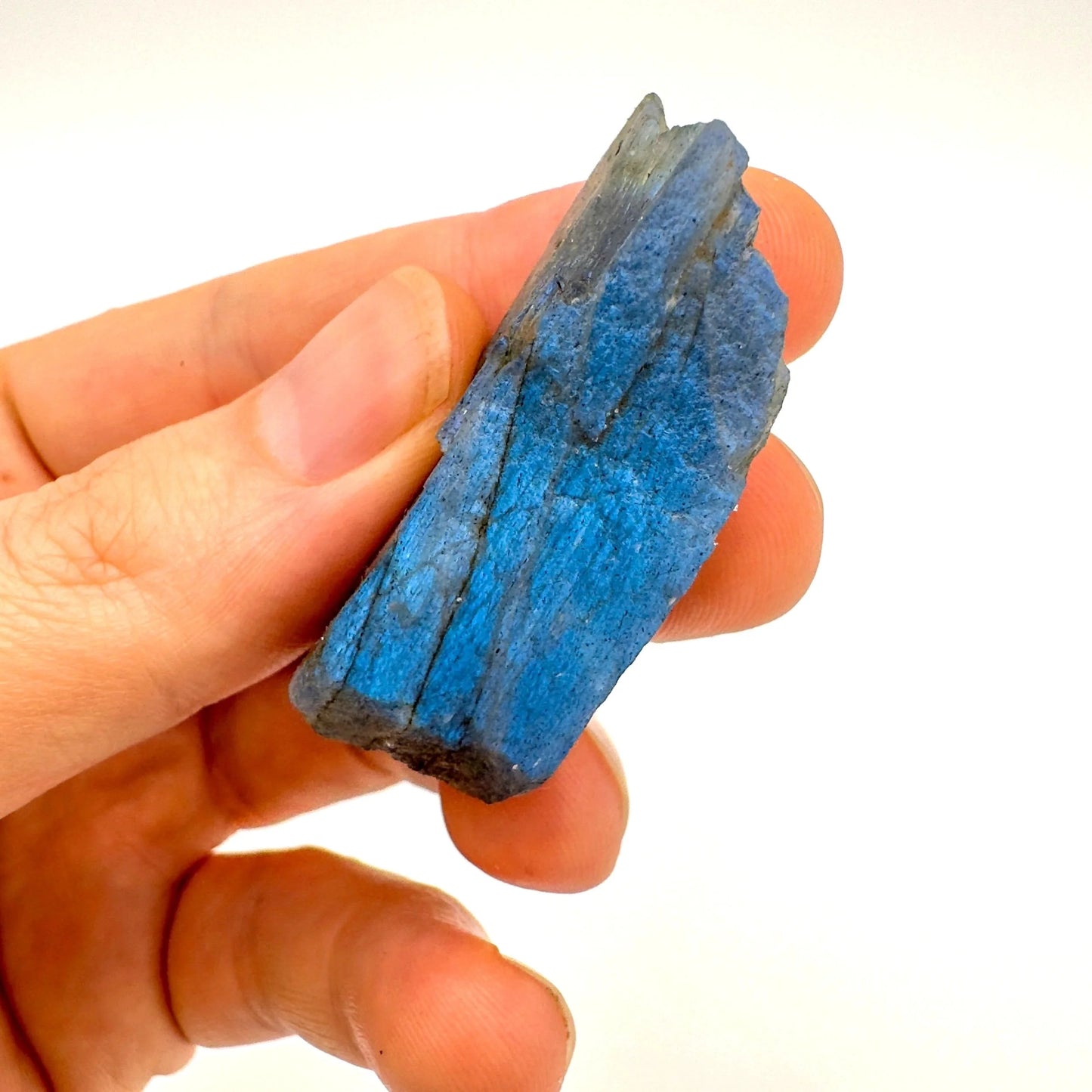 Back view of Grade AA Labradorite raw showing natural surface
