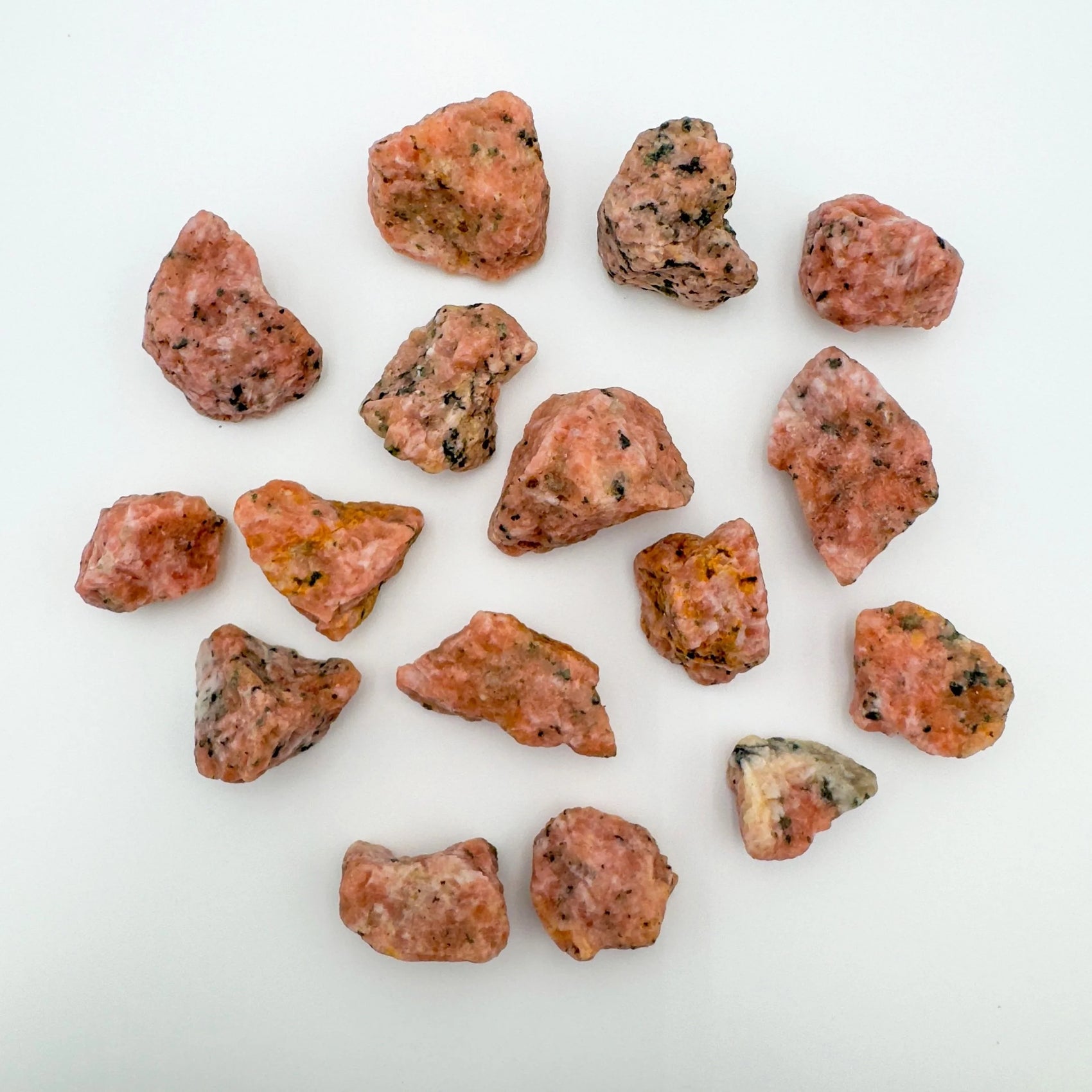 Detail shot showing Orange Calcite raw stone, sourced from Betsiboka, Madagascar, showing raw matrix.