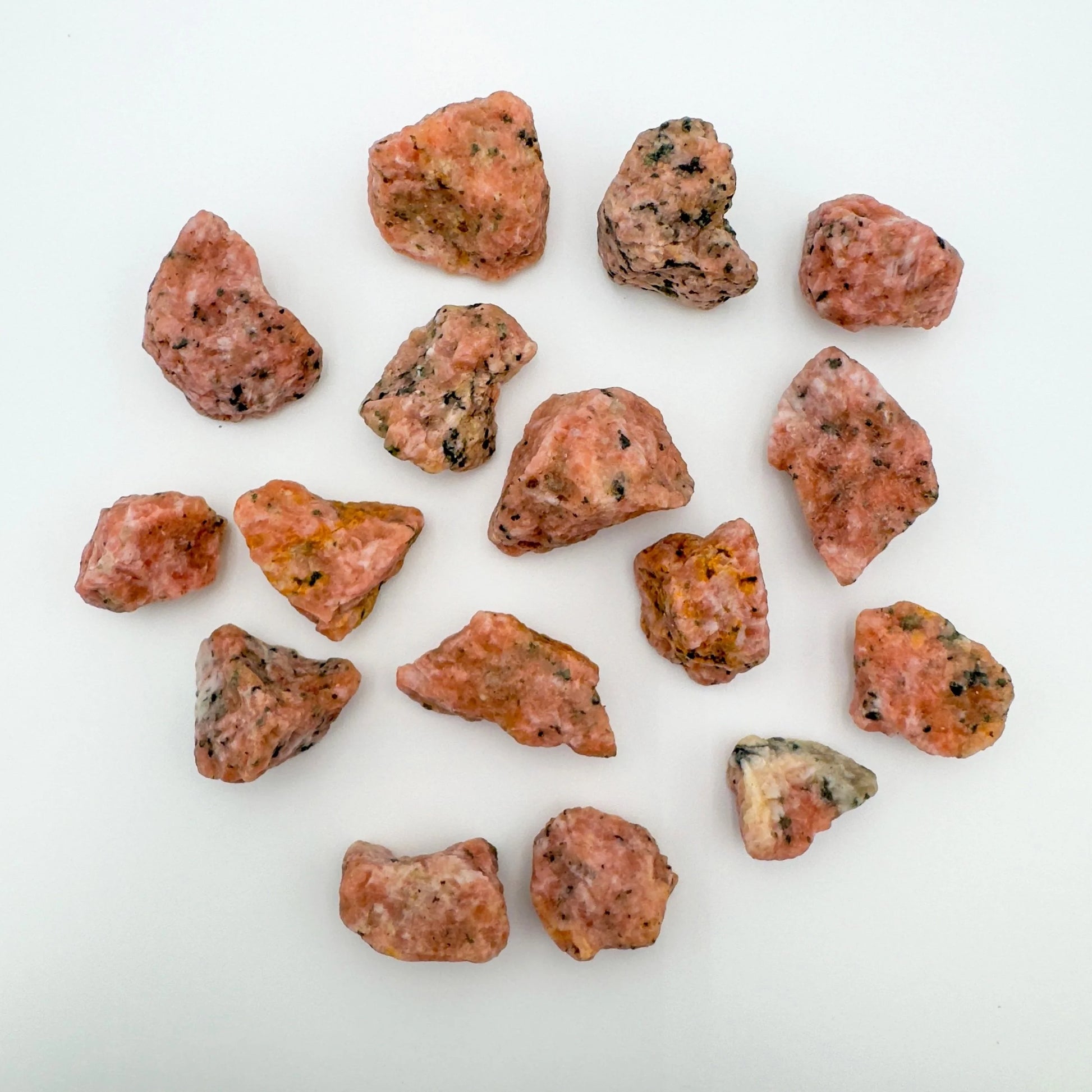 Detail shot showing Orange Calcite raw stone, sourced from Betsiboka, Madagascar, showing raw matrix.