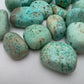 Detail of blue Chrysocolla tumbled stone, sourced from Peru.