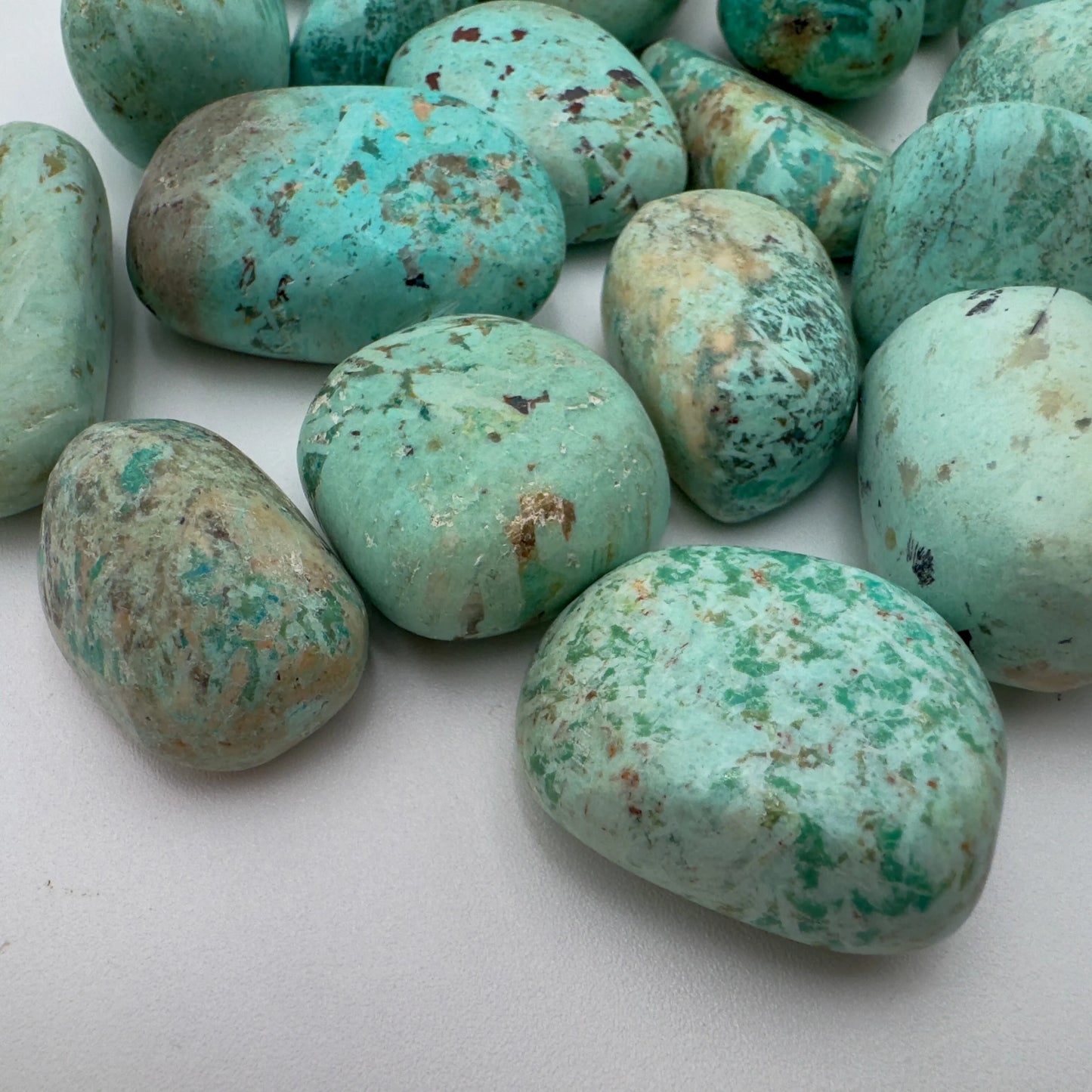 Detail of blue Chrysocolla tumbled stone, sourced from Peru.