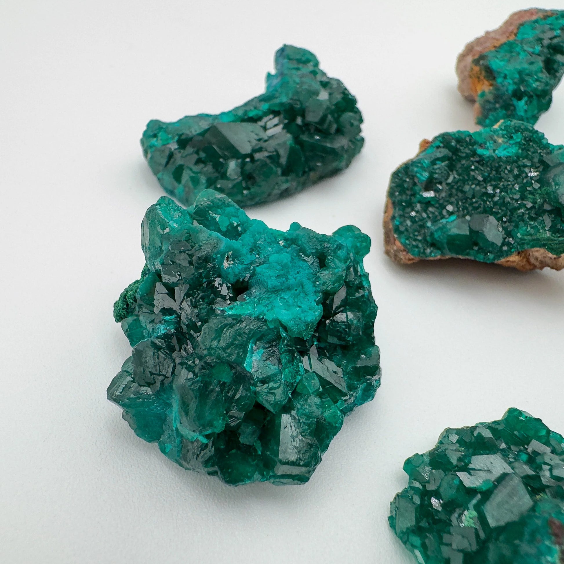 Rear view of Dioptase raw stone, kept near for Emotional Healing and Love, hand-selected from Renéville, Republic of the Congo.