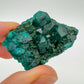 Back view of Grade AA Dioptase raw showing natural surface