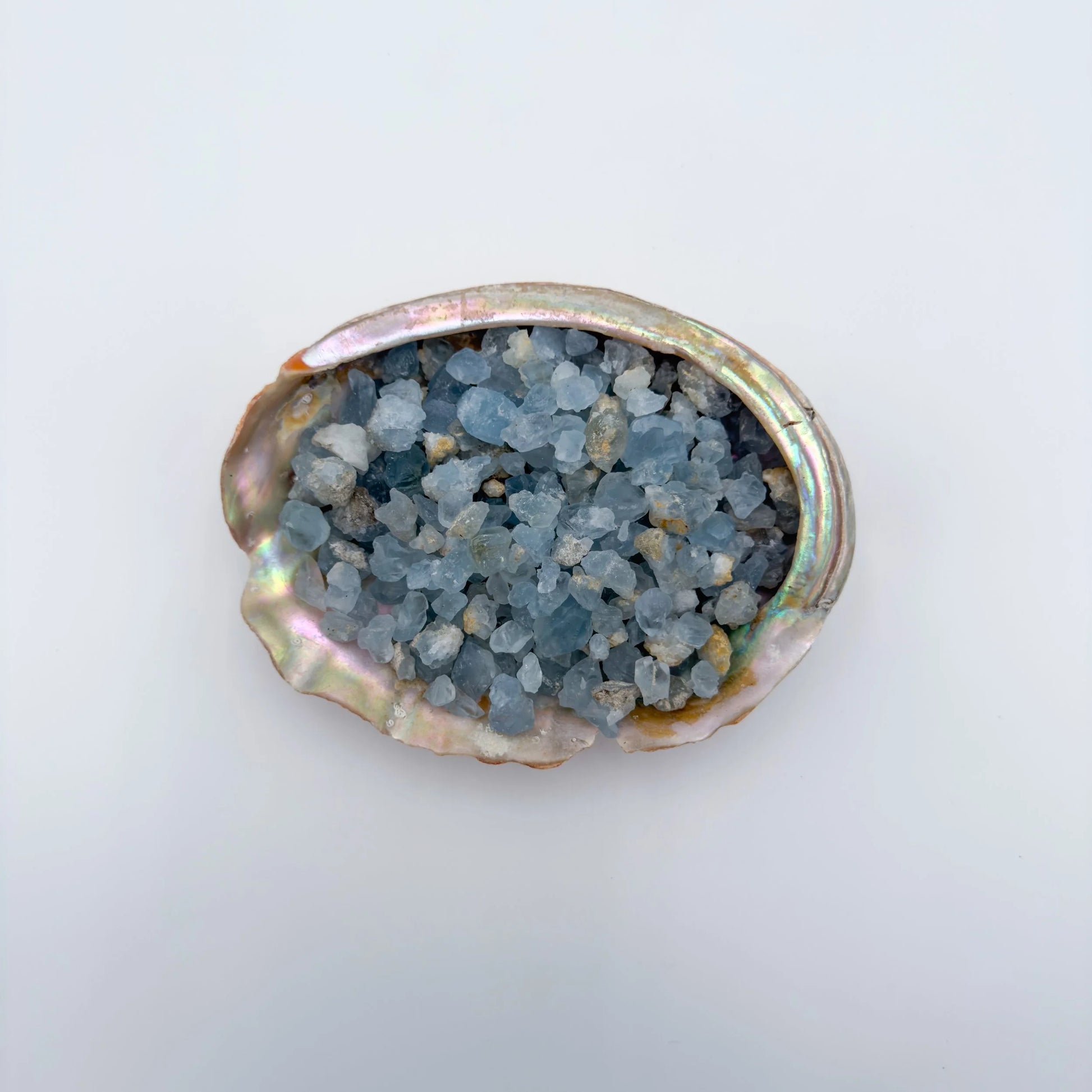 Color detail of Grade AA Celestite raw stone, often worked with for Stress Relief and Sleep, showing open form.